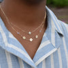 Woman with a Joy Over Everything 14k yellow gold Necklace featuring two 4 mm Moonstones and three 1/4