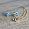 Necklace and a pair of 14k gold Greenwich earrings each featuring four 4 mm Nantucket blue topaz and one 2.1 mm diamond