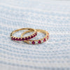 Two Rosecliff stackable rings featuring 2mm round cut rubies, one with alternating diamonds, prong set in 14k gold