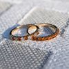 Pair of Rosecliff stackable rings featuring citrines, one with alternating diamonds, prong set in 14k yellow gold