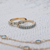 Pair of Rosecliff stackable rings featuring Nantucket blue topaz, one with alternating diamonds, prong set in 14k yellow gold