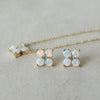 Pair of Greenwich earrings and a necklace in 14k gold featuring 4 mm faceted round cut opals and 2.1 mm diamonds