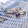 Grand amethyst ring and a Rosecliff stackable ring that features eleven 2 mm round cut amethysts prong set in 14k gold
