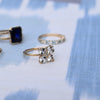 Assorted rings including a Greenwich ring featuring four 4 mm round white topaz and one 2.1 mm diamond prong set in 14k gold
