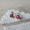 Pair of 14k gold Greenwich 1 Birthstone earrings each featuring one 4 mm ruby and one 2.1 mm diamond