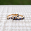 Two Rosecliff stackable rings featuring 2mm round cut sapphires, one with alternating diamonds, prong set in 14k gold